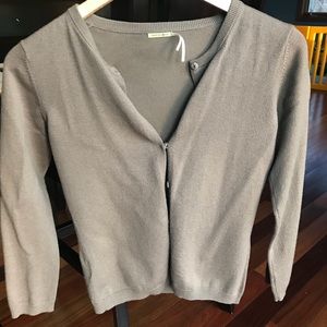 Light a brown MaxStudio cardigan.